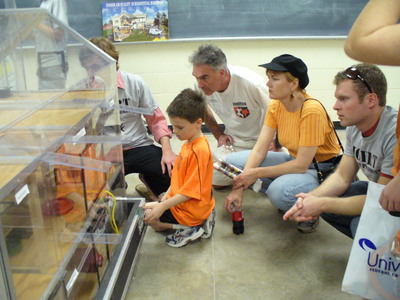 UT-Austin IGERT trainees Brent Stephens (left) and Sonny Rosenthal (right, in gray IGERT T-shirts) demonstrate concepts of pollution sources and transport