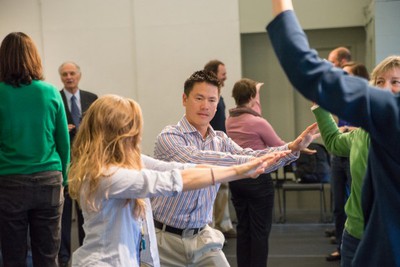 Gifford Wong, center, participates in a theater exercise called “mirror” with students in the Communicating Science course at Dartmouth College. Wong is a co-developer and co-instructor of the course which has students try out a variety of improv exercise