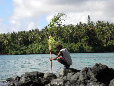 Islander placing taboo marker